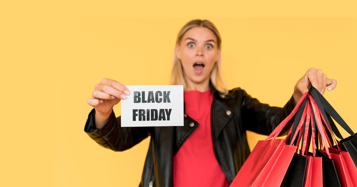 Mujer con bolsas de compras de Black Friday